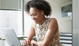 smiling woman at laptop
