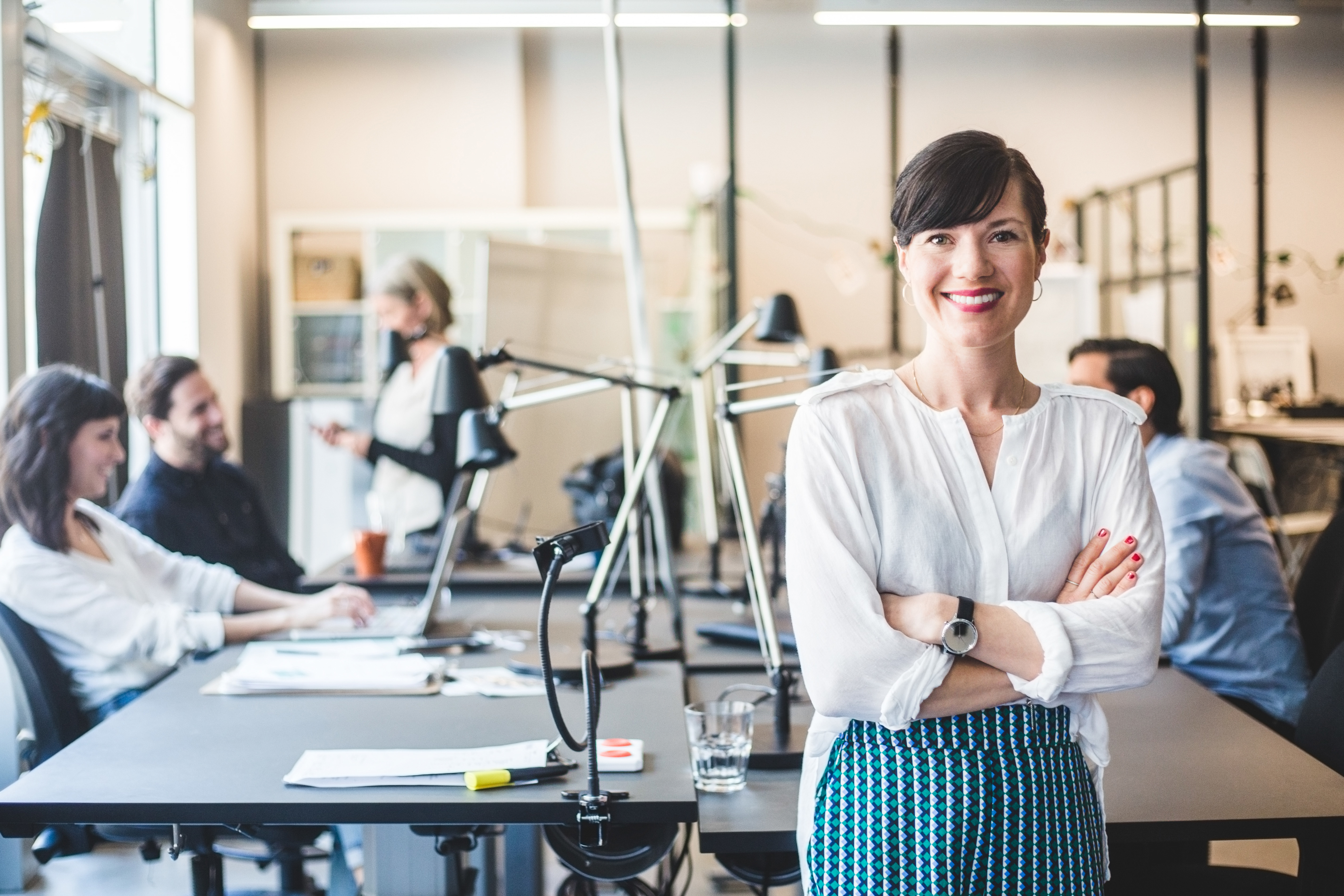 &nbsp;Portrayal of a Capella University online project management business student in an office.