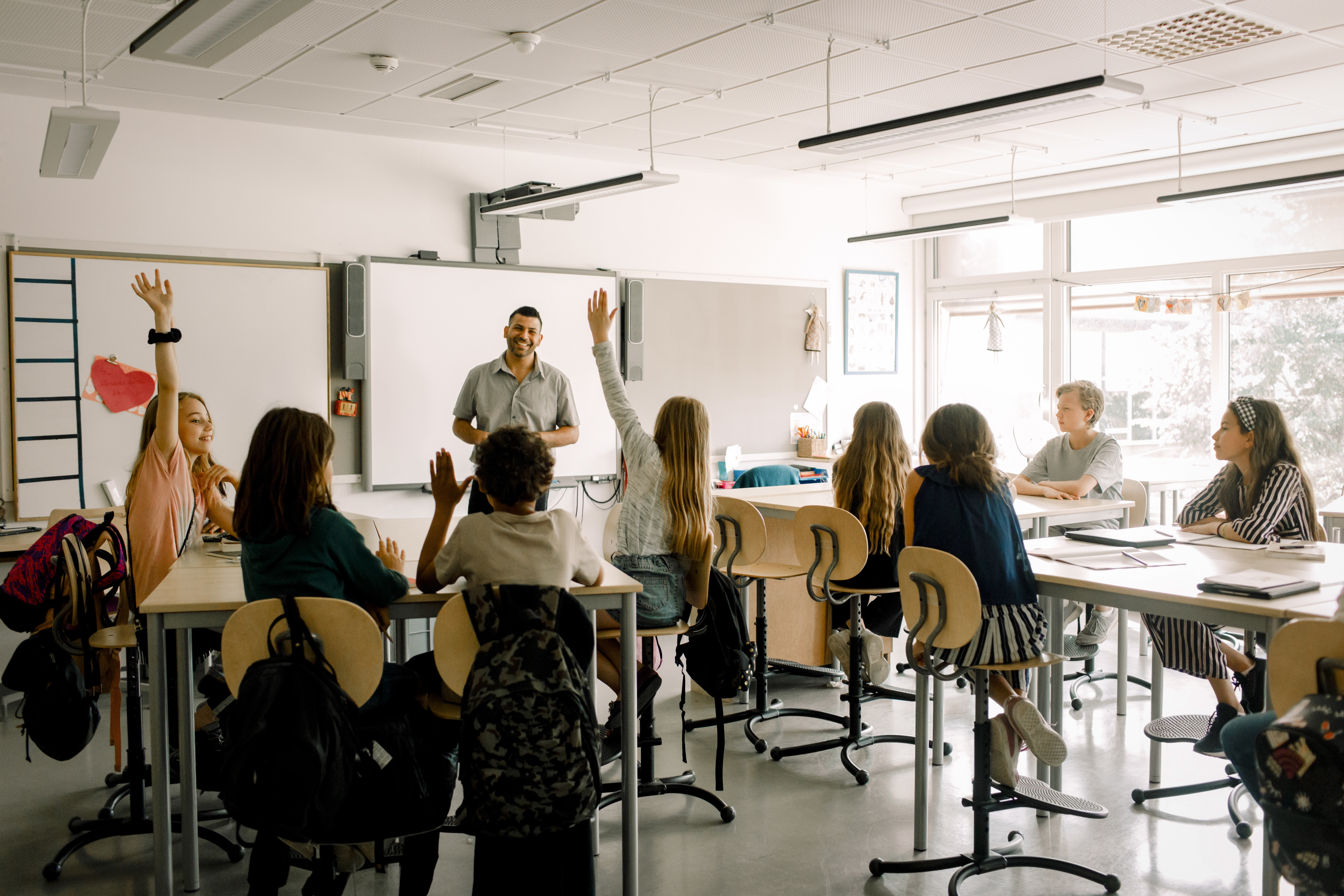Portrayal of Capella education student in K-12 classroom setting.