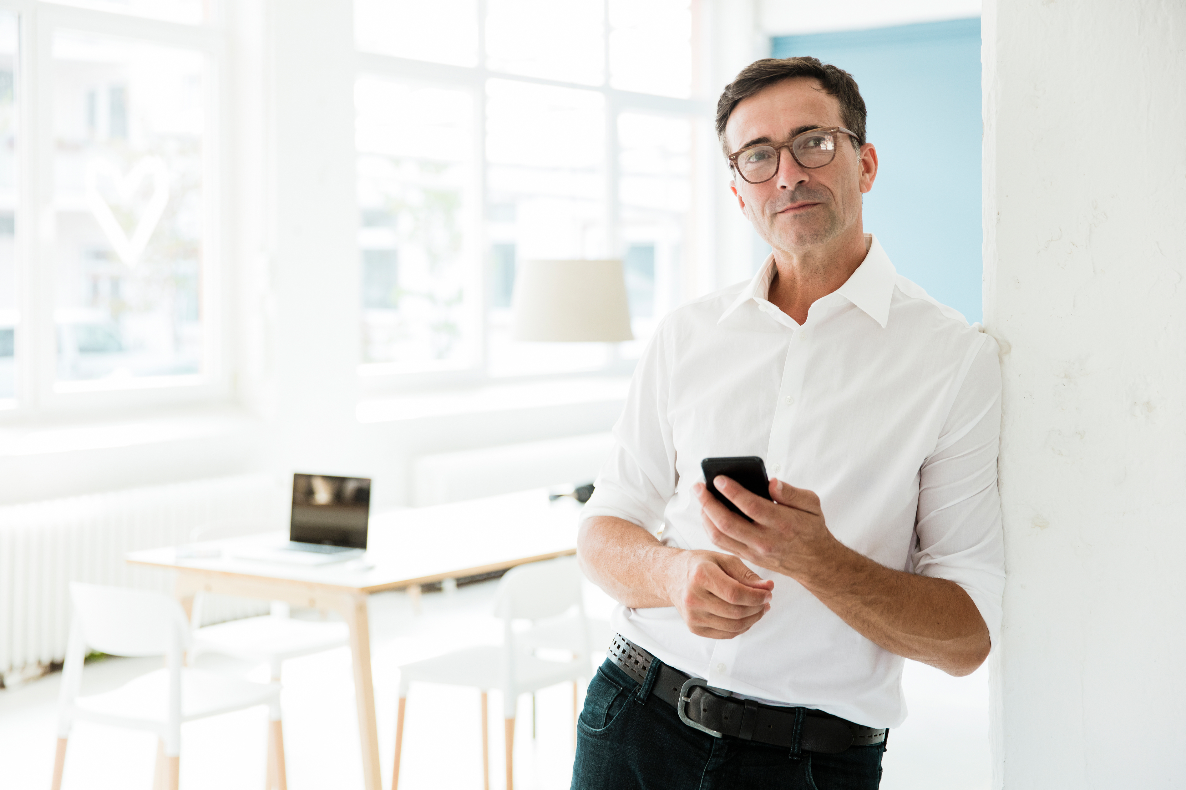 Portrayal of a Capella University online Master of Public Health student using his cell phone