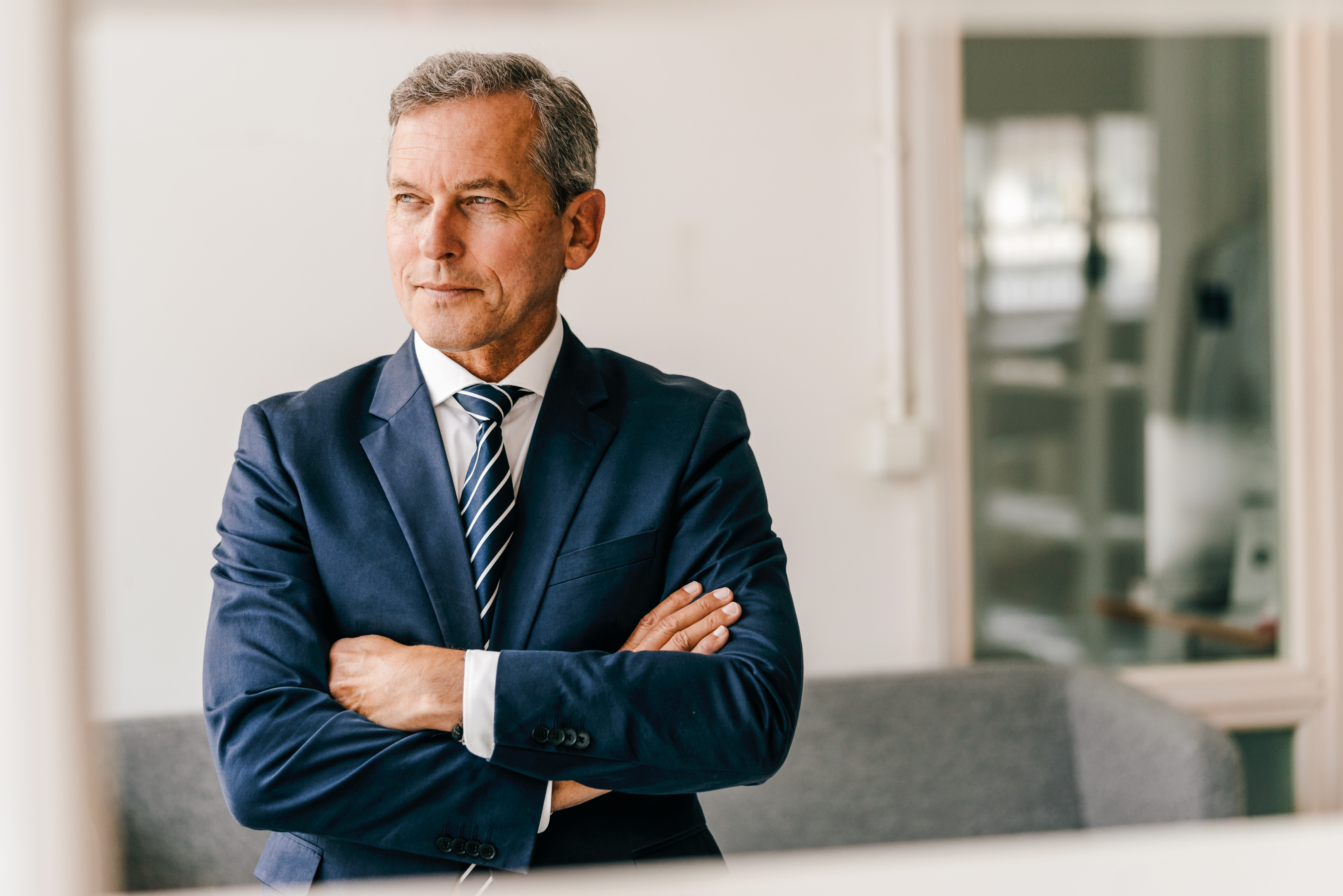 Portrayal of a Capella University online business student in a blue suit