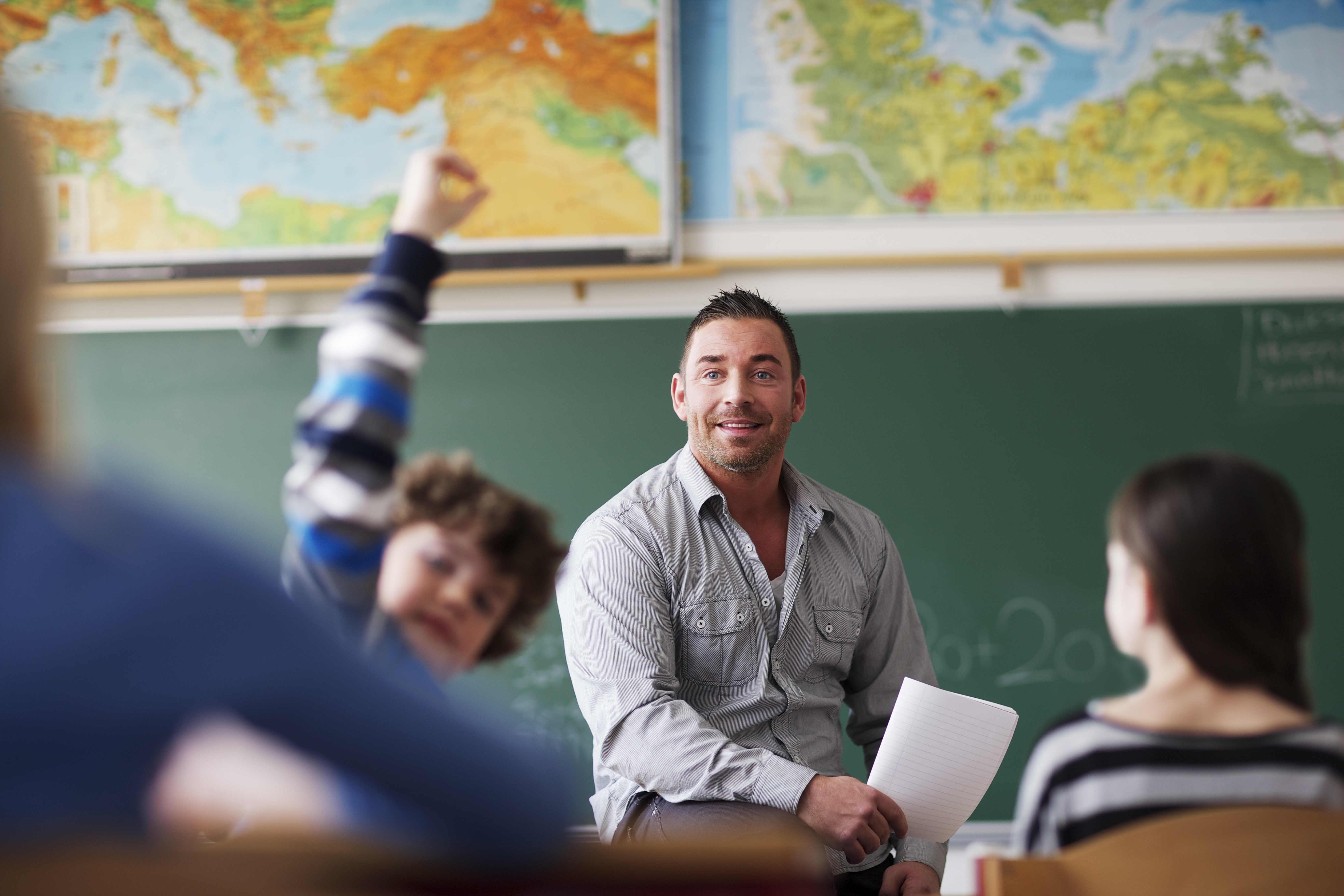 Portrayal of a Capella University online education alum teaching in a classroom