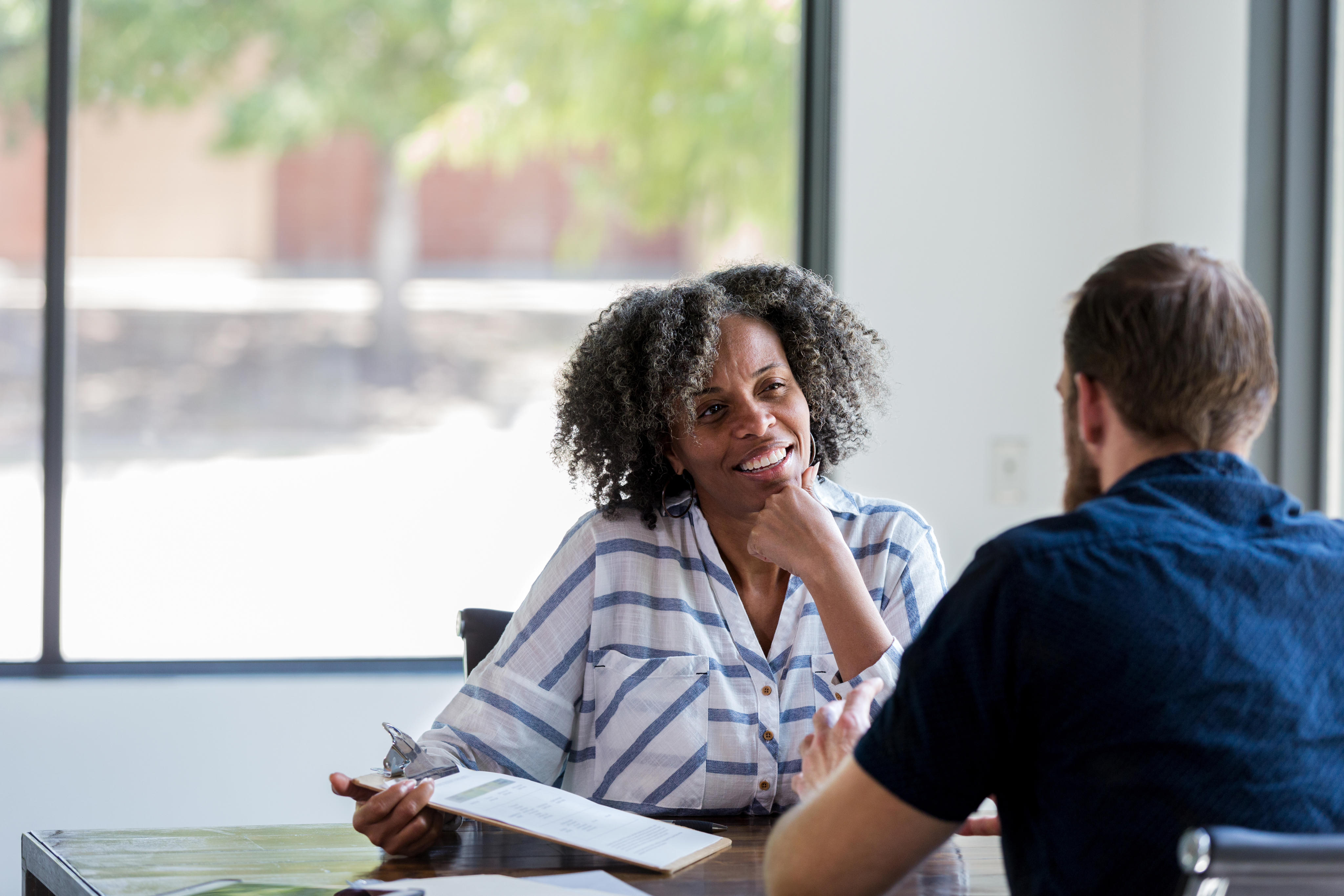 Portrayal of a Capella University psychology alum in a counseling session