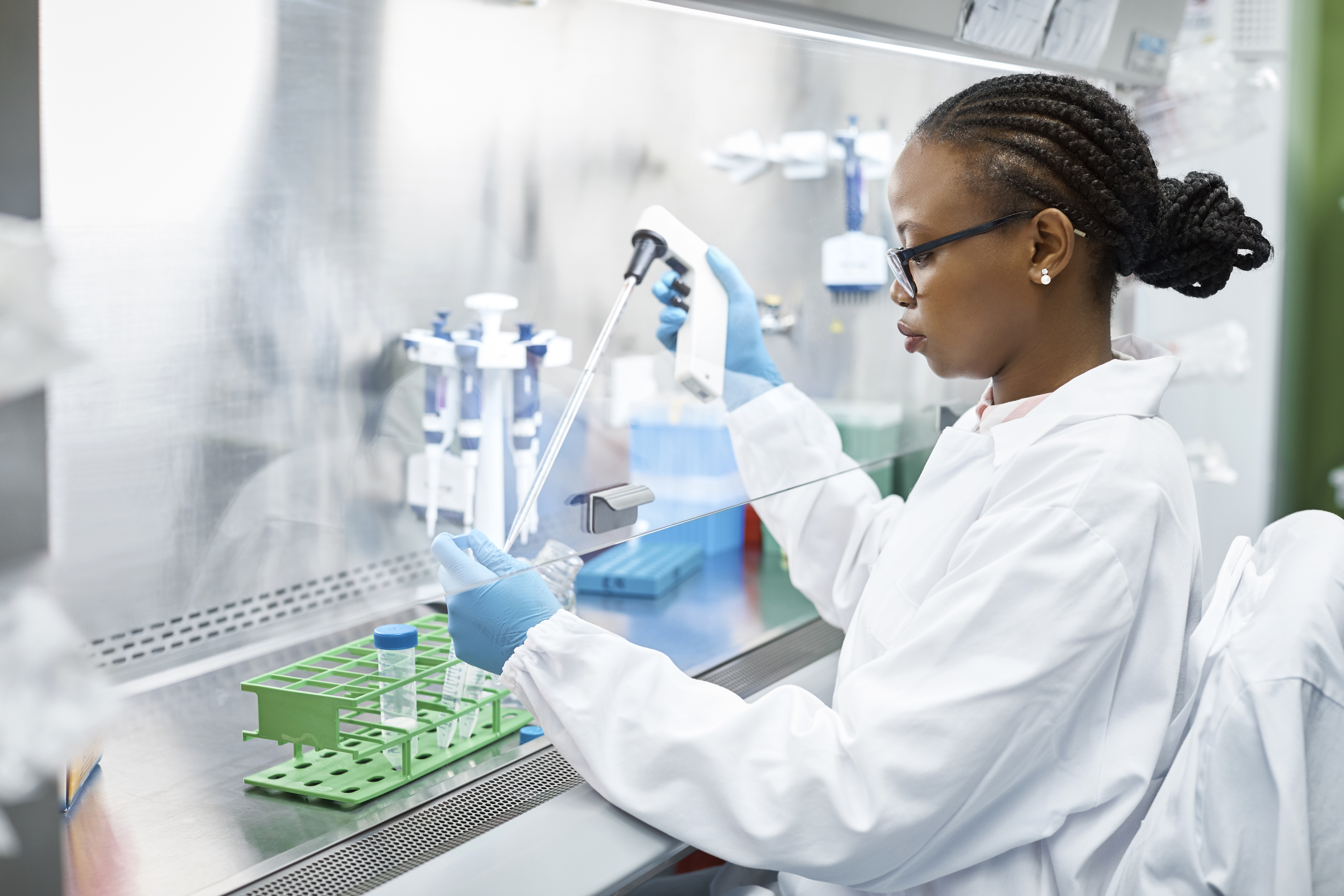 Portrayal of a Capella University online health sciences student conducting research in a lab