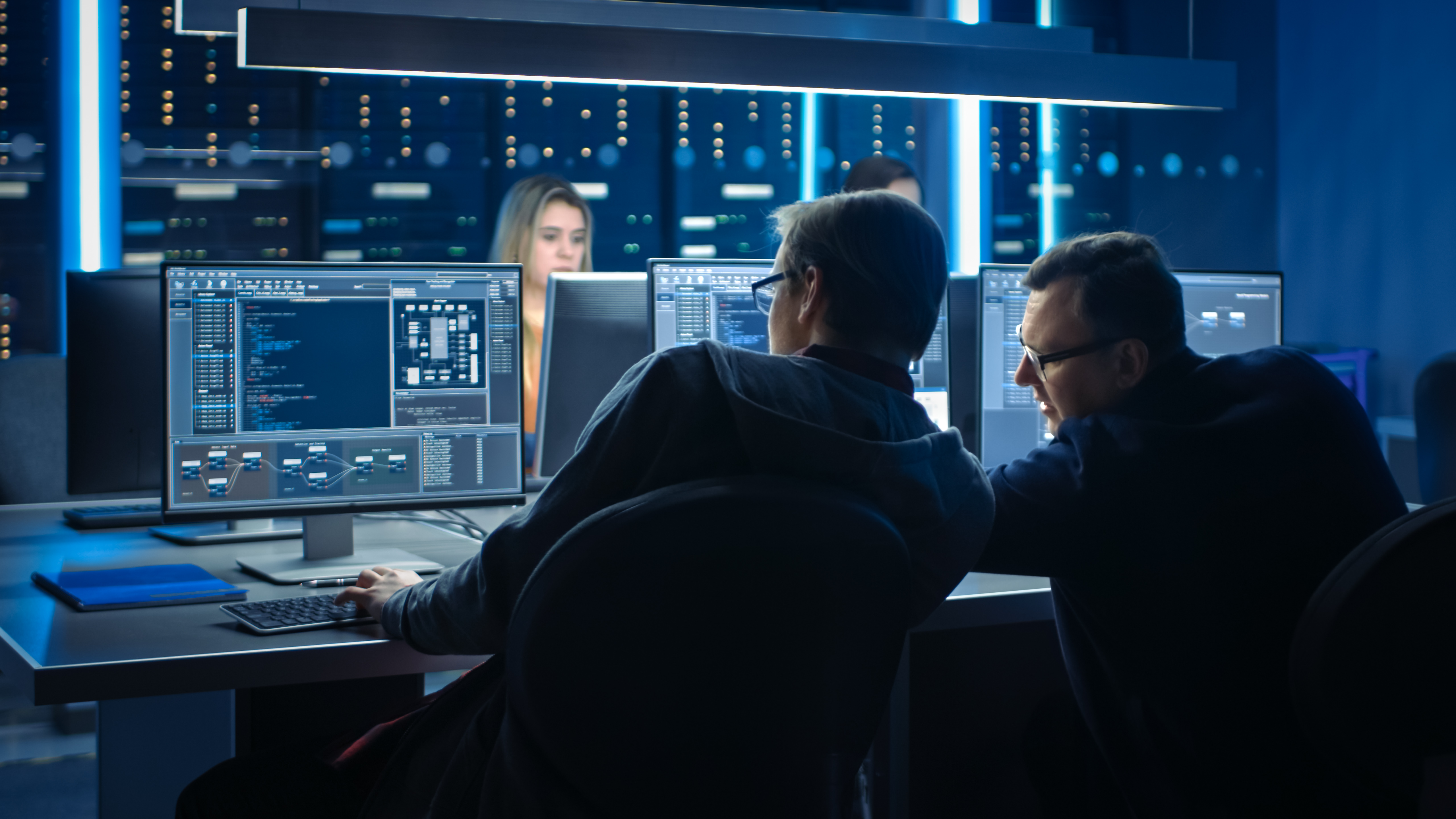 Portrayal of Capella students in IT setting communicating technology issues and solutions