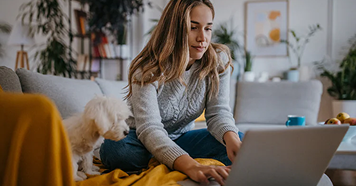 woman on sofa with dog