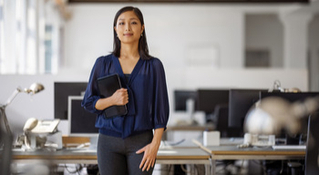 woman in blue top smiling